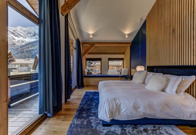 Bedroom 1, master suite with dressing area and bathroom Bedroom 1 of Chalet les Trois Soeurs is a master suite with dressing area and bathroom