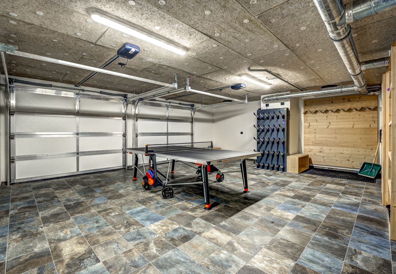 Garage with electric car charger, boot dryers and ski storage     Chalet les Trois Soeurs has a double garage with electric car charger, heated boot dryers and ski storage