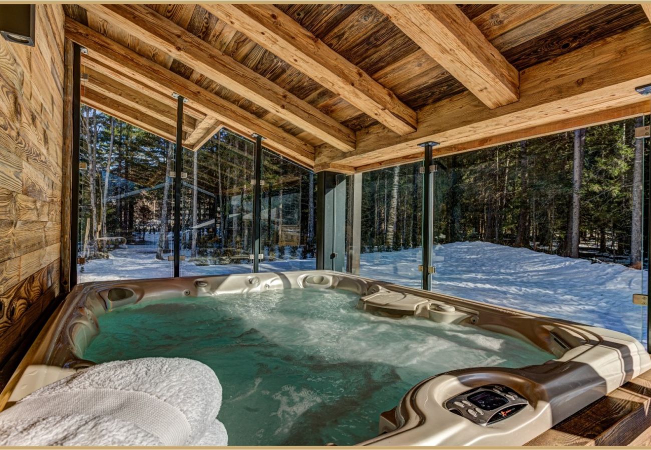 Hot tub on balcony off living area  Chalet Black Pearl has a hot tub on the balcony off the living area