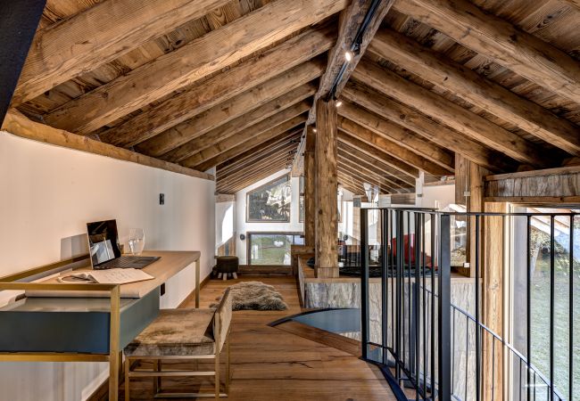 Stairs lead to a mezzanine level Stairs lead to a mezzanine level in Chalet les Côtés du Lavancher.