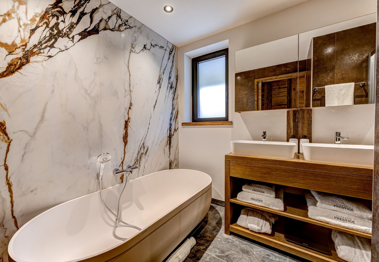Beautiful ensuite to Bedroom 1 with stand alone bath Chalet les Côtés du Lavancher  has a beautiful ensuite to Bedroom 1 with a stand alone bath.